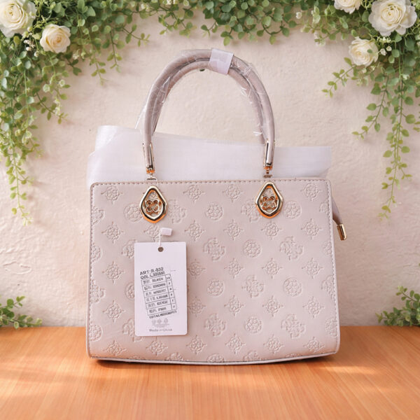 Sac beige à motif avec poignet